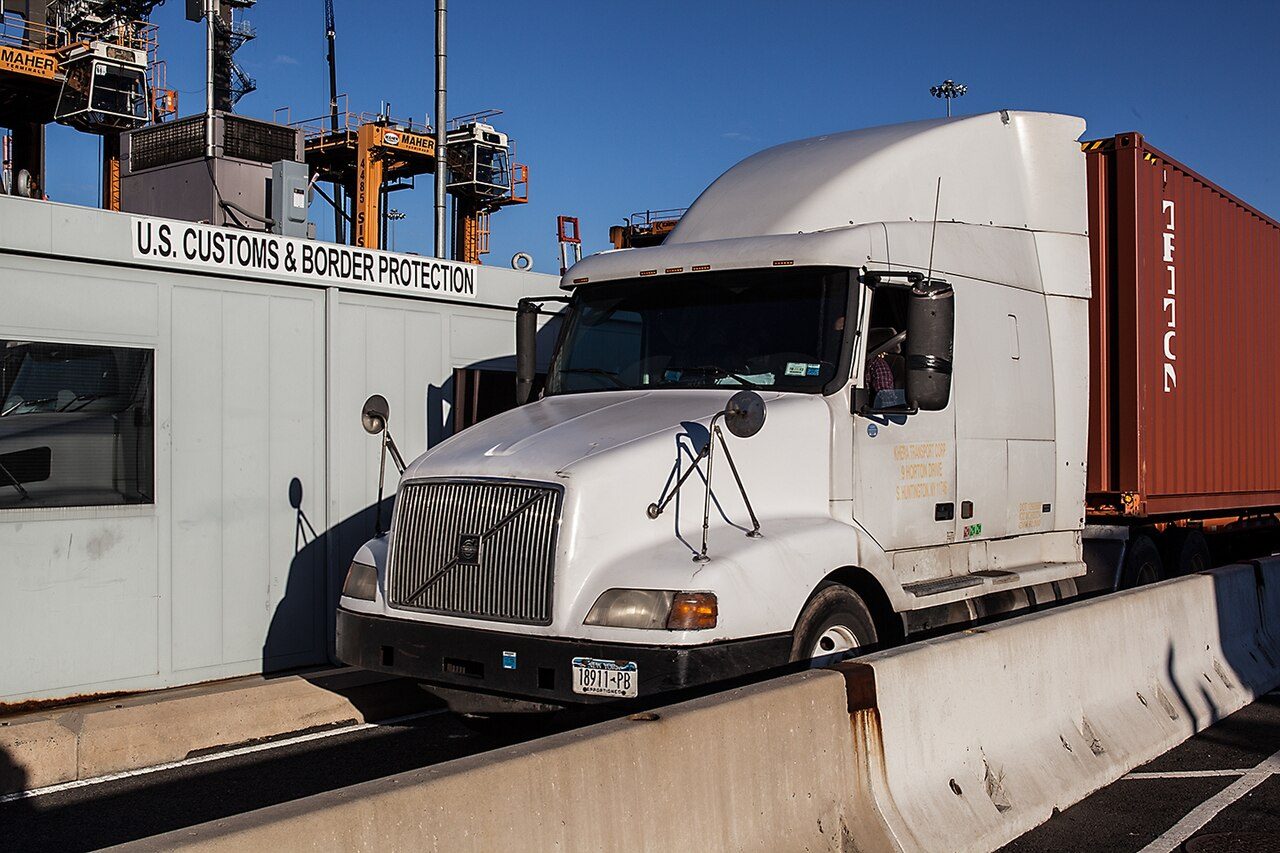 Trucks passing through radiation portal monitors at a US port